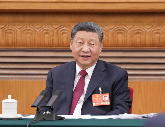 Xi takes part in deliberation at annual national legislative session